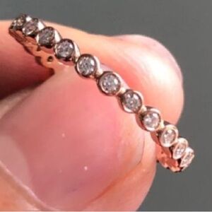 10k rose gold bezel set ring size 5.75 with moissanite stones